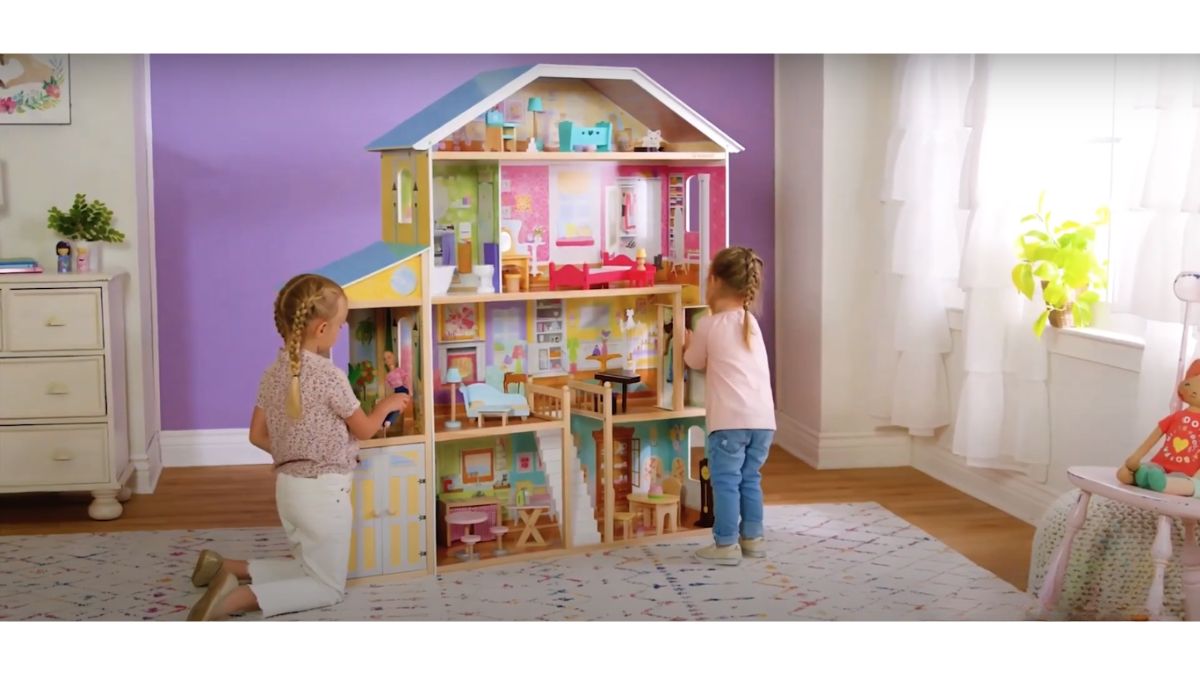 kids playing with Majestic Mansion Wooden Dollhouse